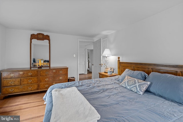 bedroom with wood-type flooring