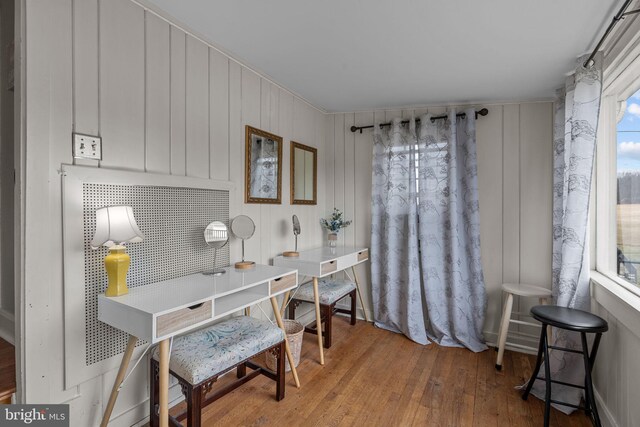 home office featuring plenty of natural light and wood-type flooring