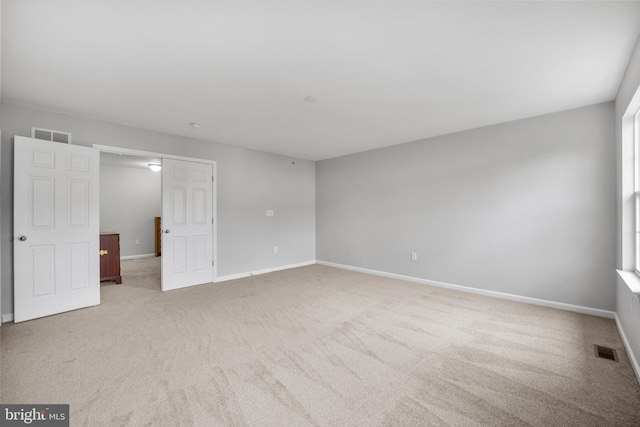 unfurnished bedroom with light carpet