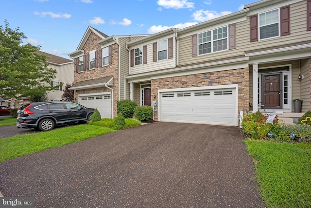 multi unit property featuring a garage