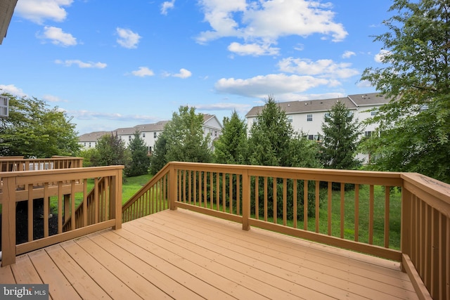 deck featuring a lawn