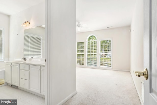 bathroom with vanity and ceiling fan