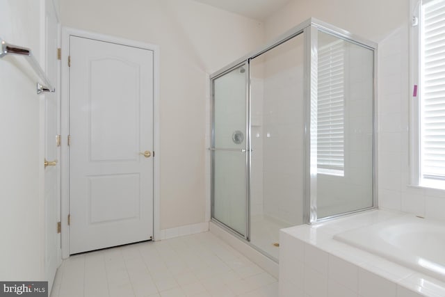 bathroom with shower with separate bathtub