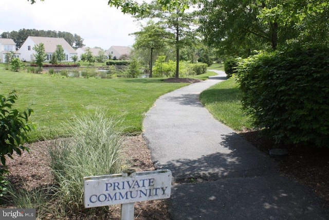 view of home's community with a lawn