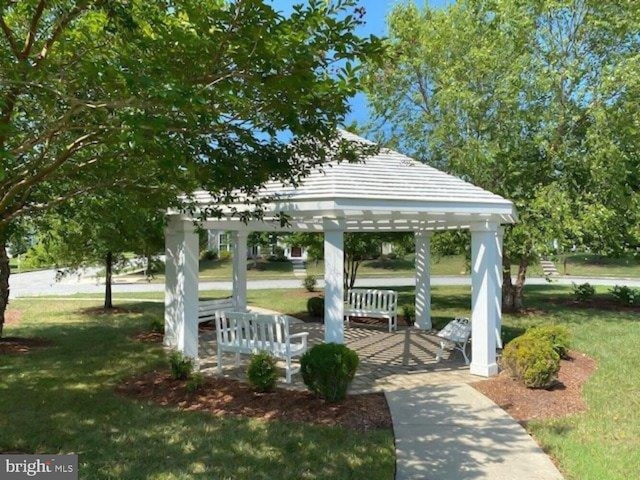 surrounding community with a gazebo and a lawn