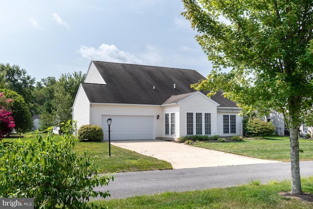 view of front facade featuring a garage and a front lawn