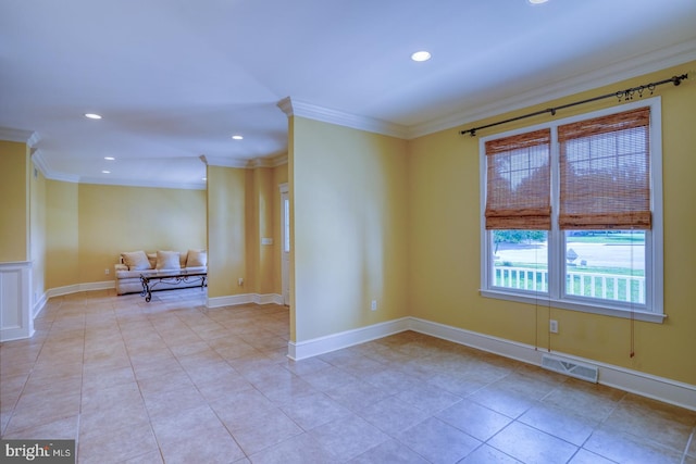 spare room with light tile patterned floors, recessed lighting, visible vents, baseboards, and ornamental molding