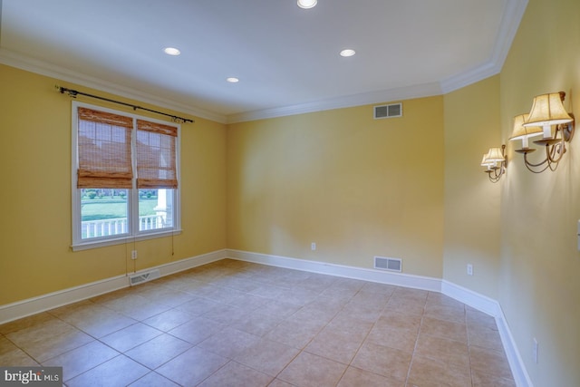 empty room featuring ornamental molding, visible vents, and baseboards