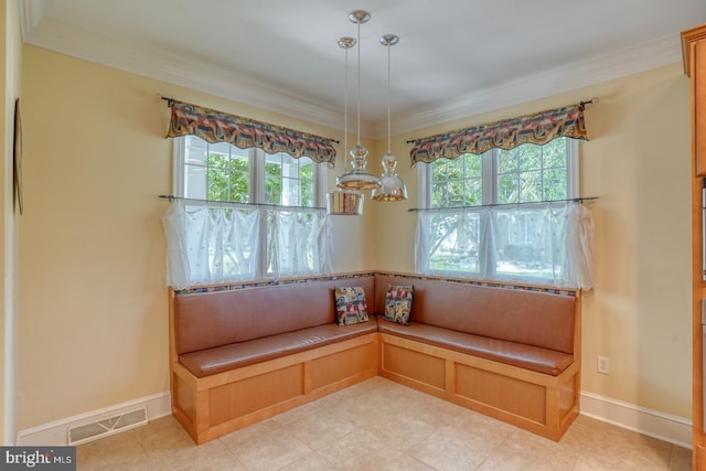 room details featuring baseboards, visible vents, and crown molding