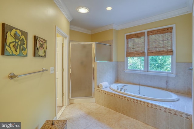 bathroom with a stall shower, ornamental molding, a garden tub, and tile patterned floors