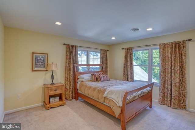 bedroom featuring light colored carpet, visible vents, baseboards, and recessed lighting