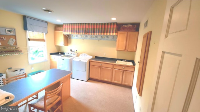 washroom featuring washing machine and dryer, recessed lighting, light carpet, visible vents, and cabinet space