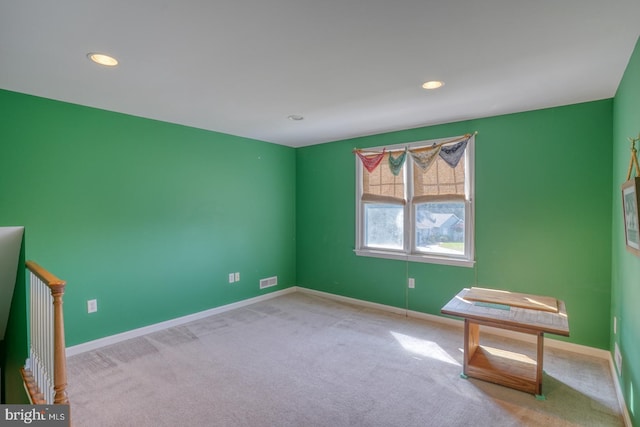 interior space with baseboards, recessed lighting, and light colored carpet