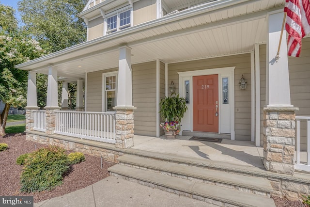 doorway to property featuring a porch