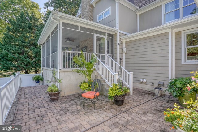 view of pool featuring a patio area, a sunroom, ceiling fan, and an in ground hot tub