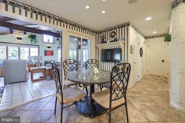 dining room featuring light tile patterned floors, vaulted ceiling, and recessed lighting