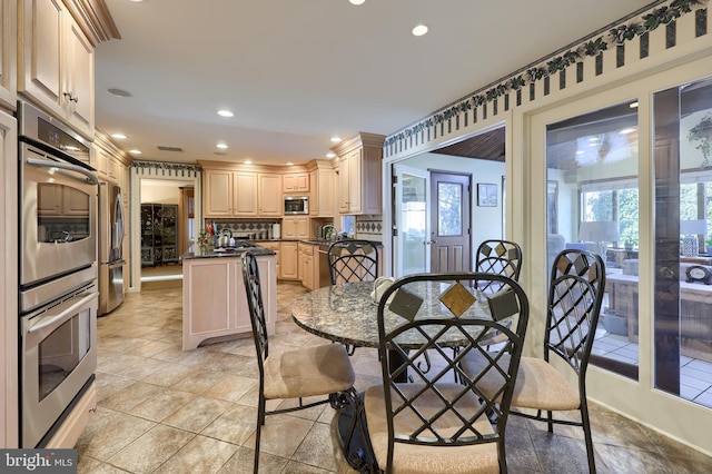 dining area featuring recessed lighting