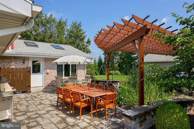 view of patio / terrace with outdoor dining area and a pergola