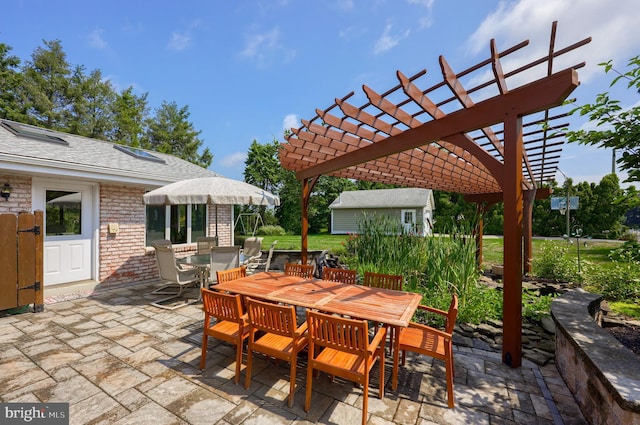 view of patio with outdoor dining area and a pergola