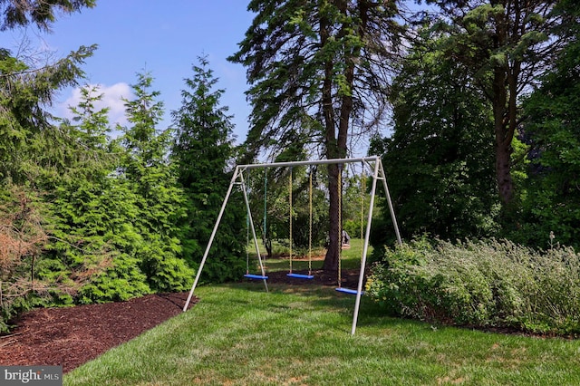 view of playground with a yard and a trampoline