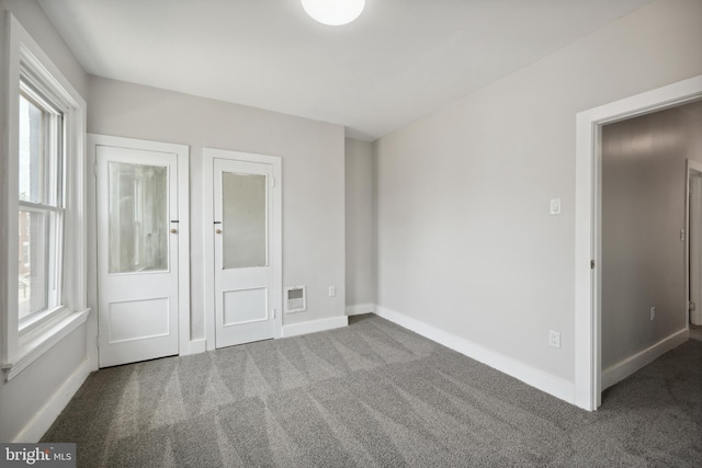 unfurnished bedroom featuring carpet flooring