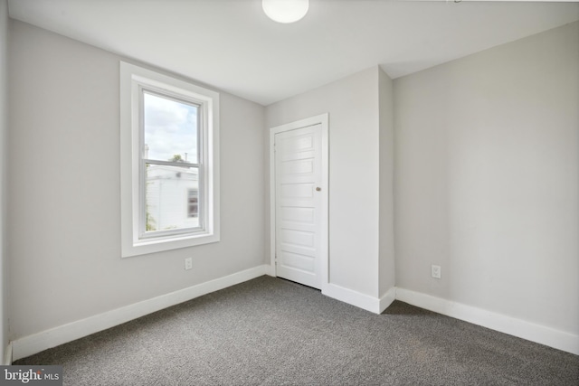 unfurnished bedroom featuring a closet and carpet