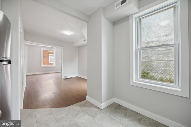 interior space featuring light tile patterned floors and a wealth of natural light