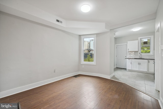 interior space with light wood-type flooring and sink