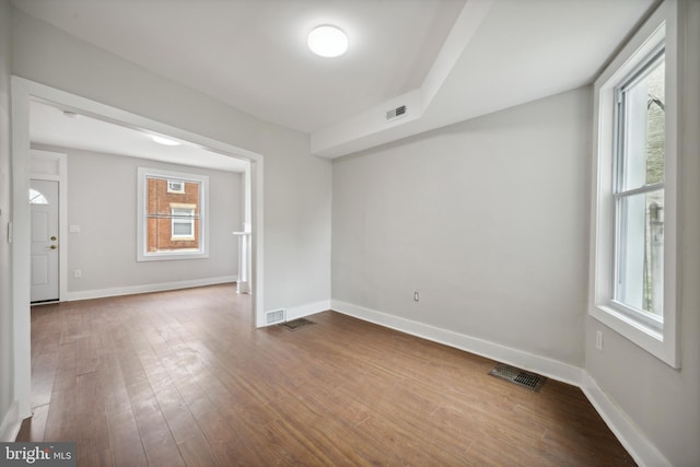 empty room with hardwood / wood-style floors