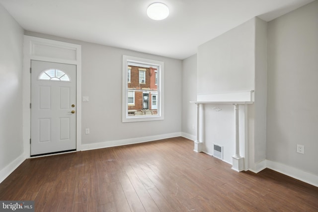 foyer entrance with hardwood / wood-style floors and a wealth of natural light