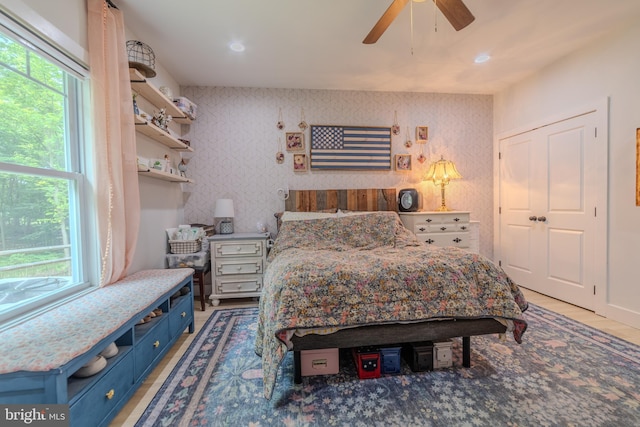 bedroom featuring ceiling fan and light hardwood / wood-style flooring