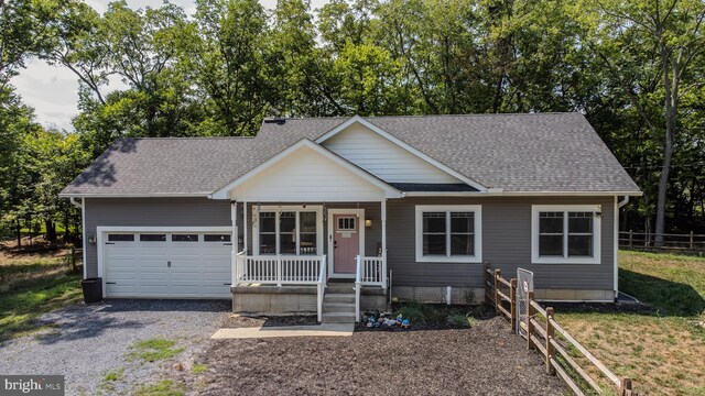 view of front of house featuring a garage and a front lawn