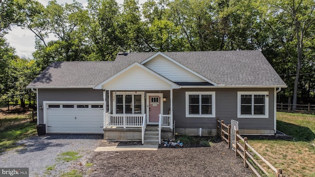 view of front of home featuring a garage and a porch