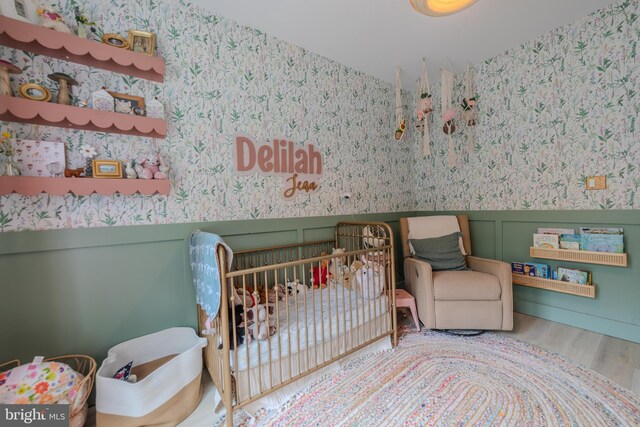 bedroom with hardwood / wood-style floors