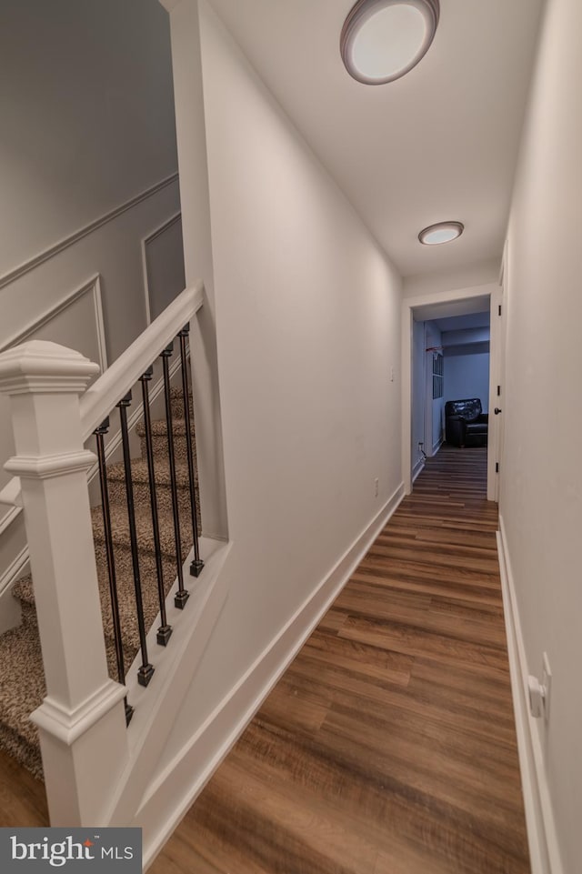 stairs with hardwood / wood-style floors