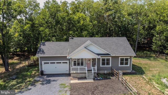 view of front of home featuring a garage and a porch