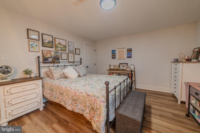 bedroom with wood-type flooring