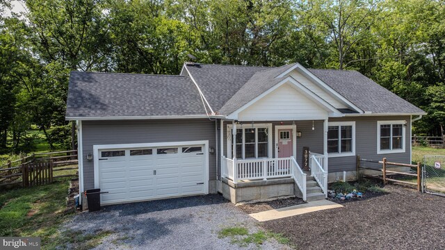 view of front facade featuring a garage and a porch