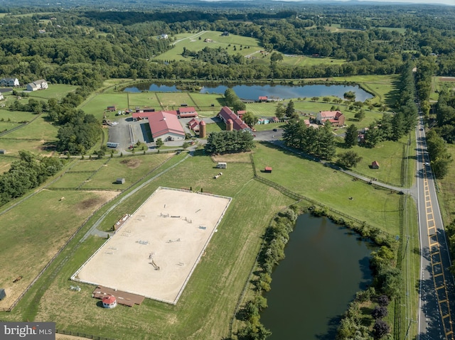 bird's eye view with a water view and a rural view