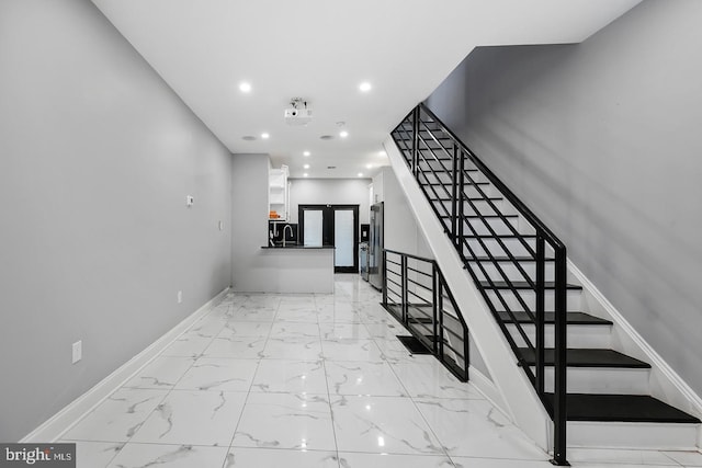 stairs with tile patterned flooring