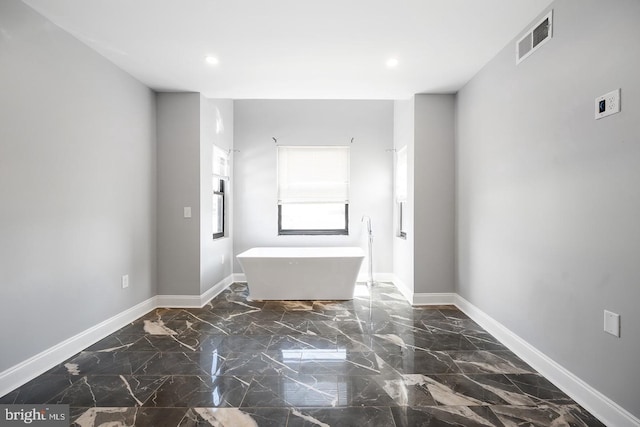 bathroom with a tub