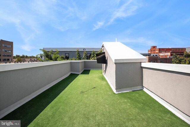 view of yard with a balcony