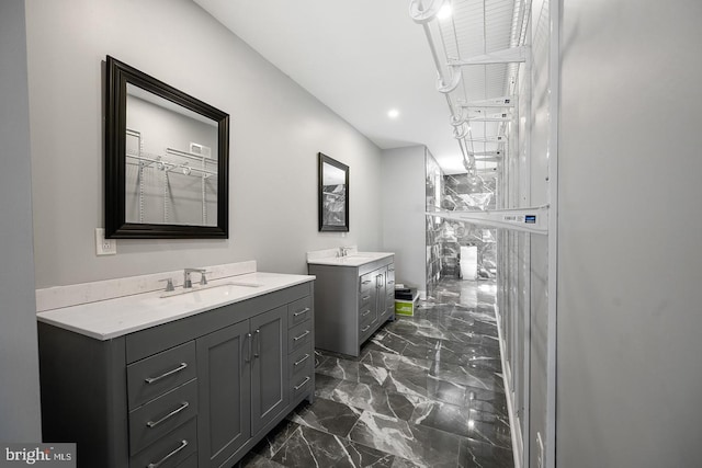 bathroom with double sink vanity and tile patterned flooring