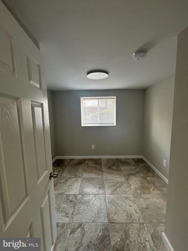 empty room with tile patterned floors