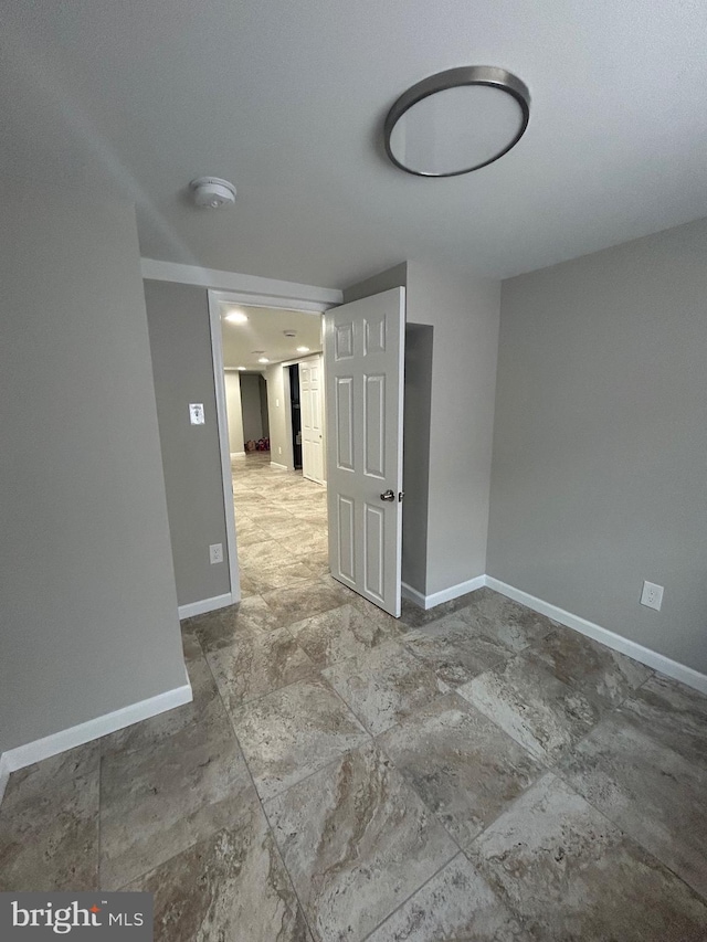 spare room featuring tile patterned flooring