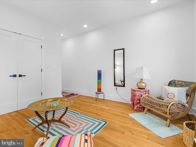 sitting room with light hardwood / wood-style floors