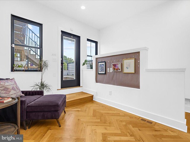 living area with light parquet flooring