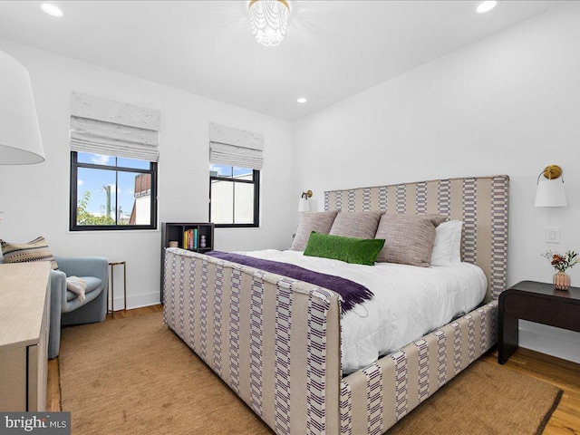 bedroom with light hardwood / wood-style floors