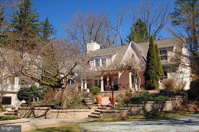 view of front of home with a chimney