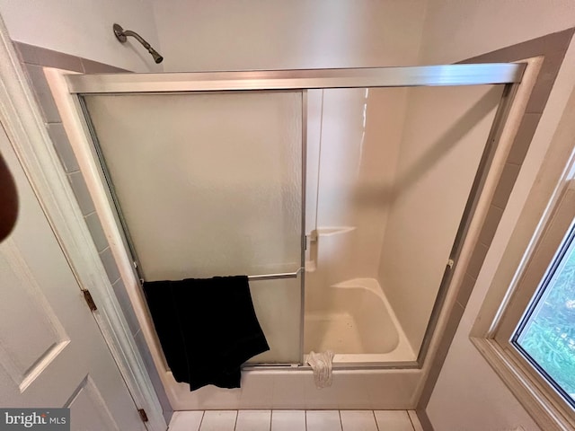 full bath with tile patterned flooring and a stall shower